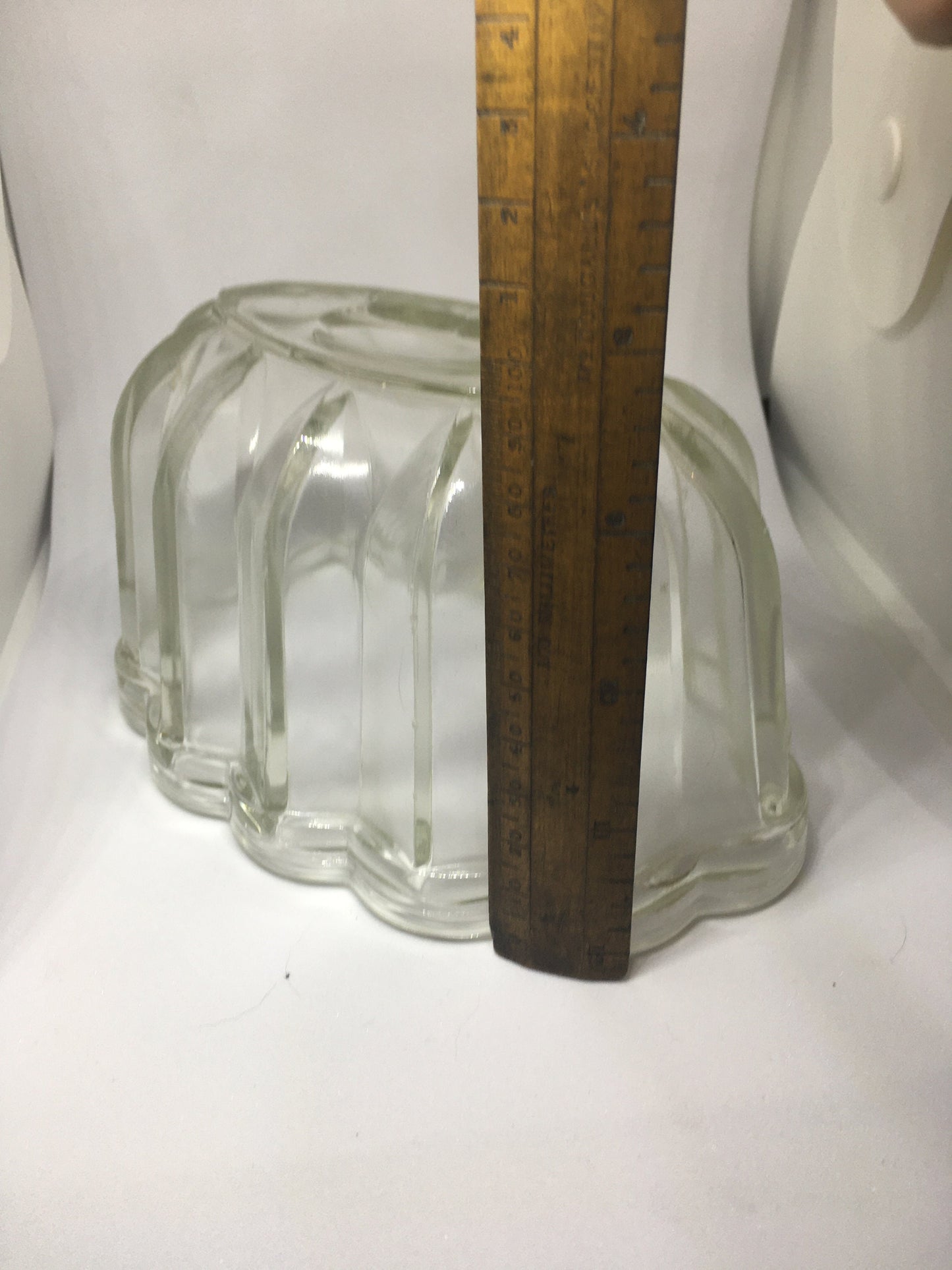 Vintage glass jelly mould. Clear pressed glass with scalloped edge. 10cm deep 16cm long.