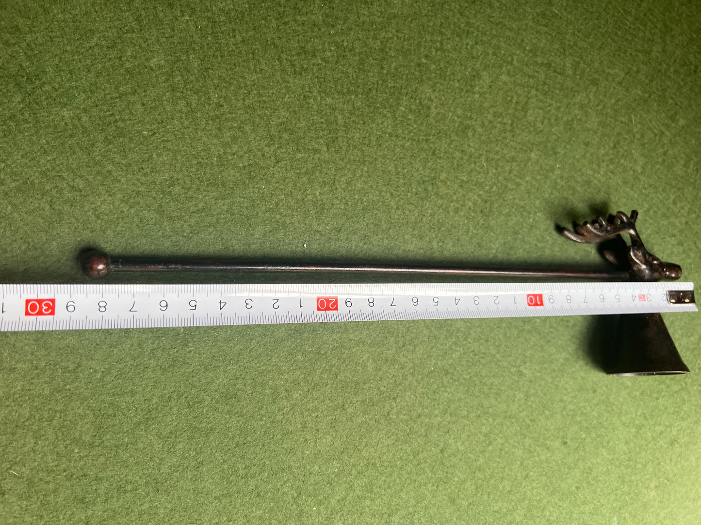 Vintage stag head candle snuffer. Black metal long handled candle extinguisher.