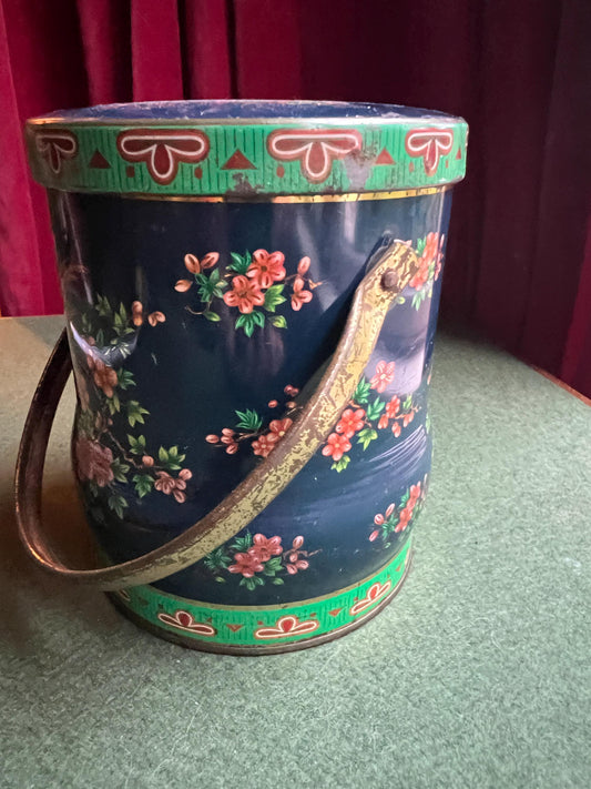 Vintage decorative lidded tin.  Bird and floral decor. Stamped The Tin Box Company Daher.
