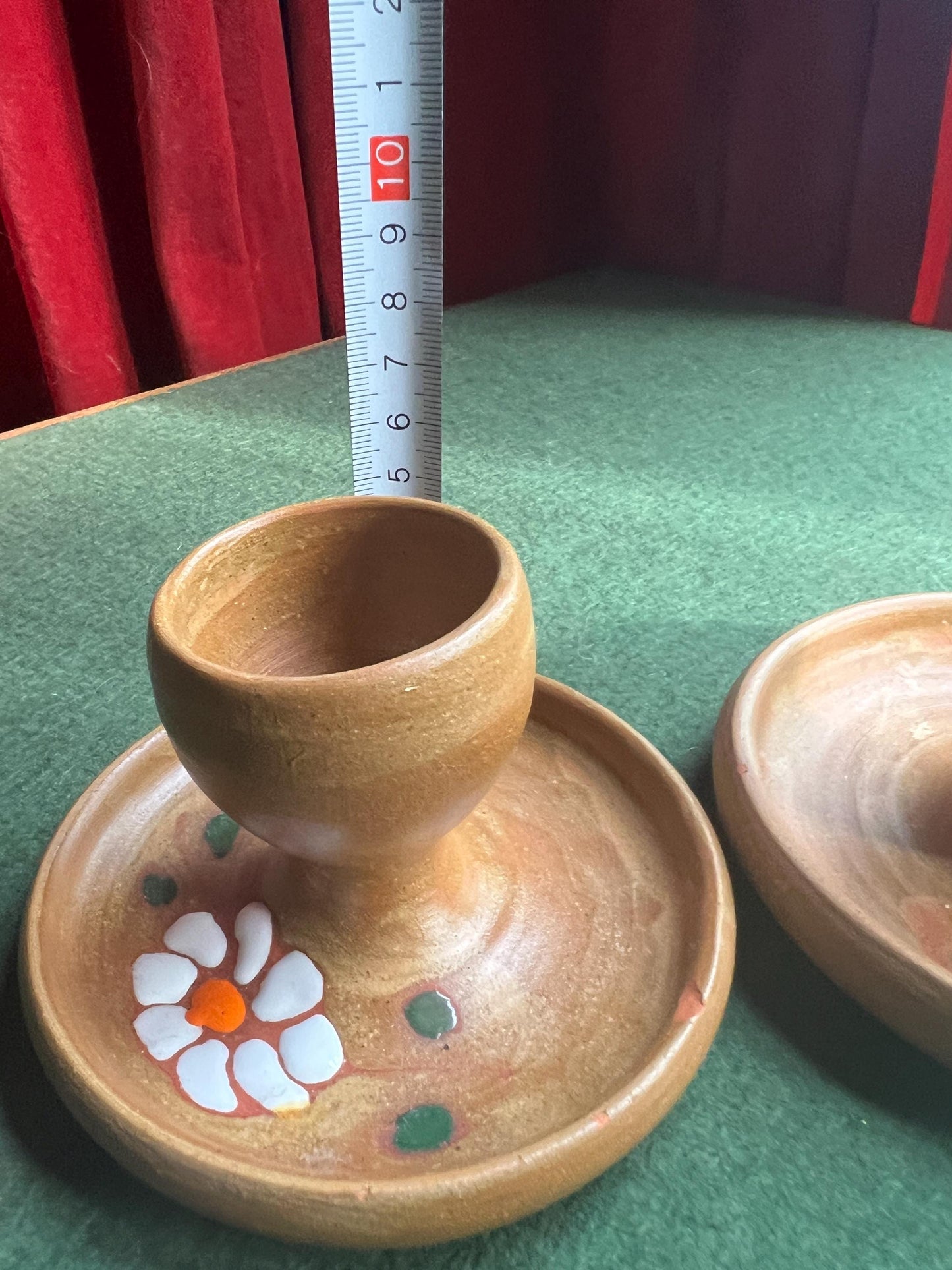 Pair of ceramic egg cups. Studio pottery brown glazed egg cups with integral saucers,