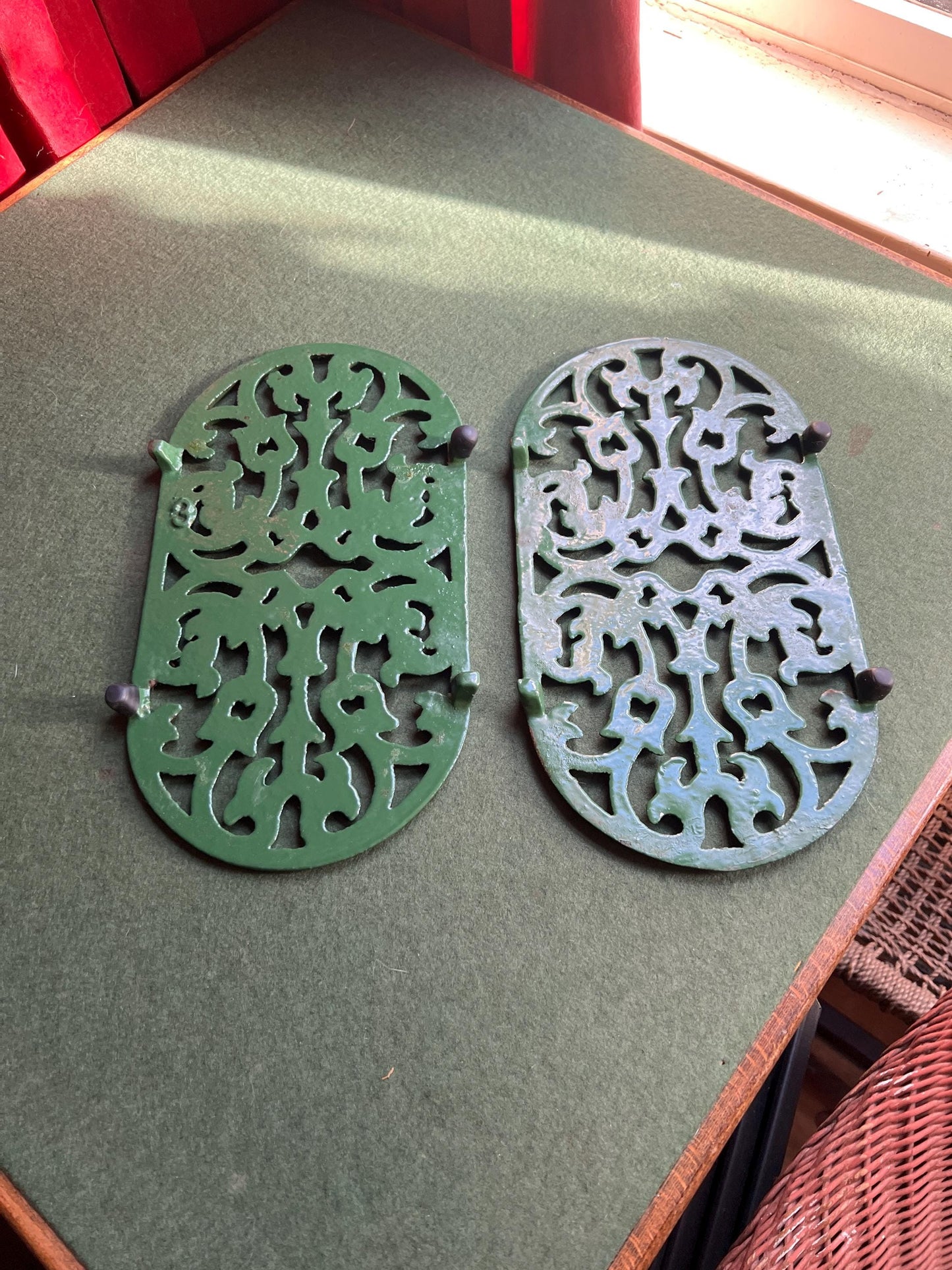 Vintage cast iron trivets. Large Oval green 4 footed trivets. 2 available. Sold separately.