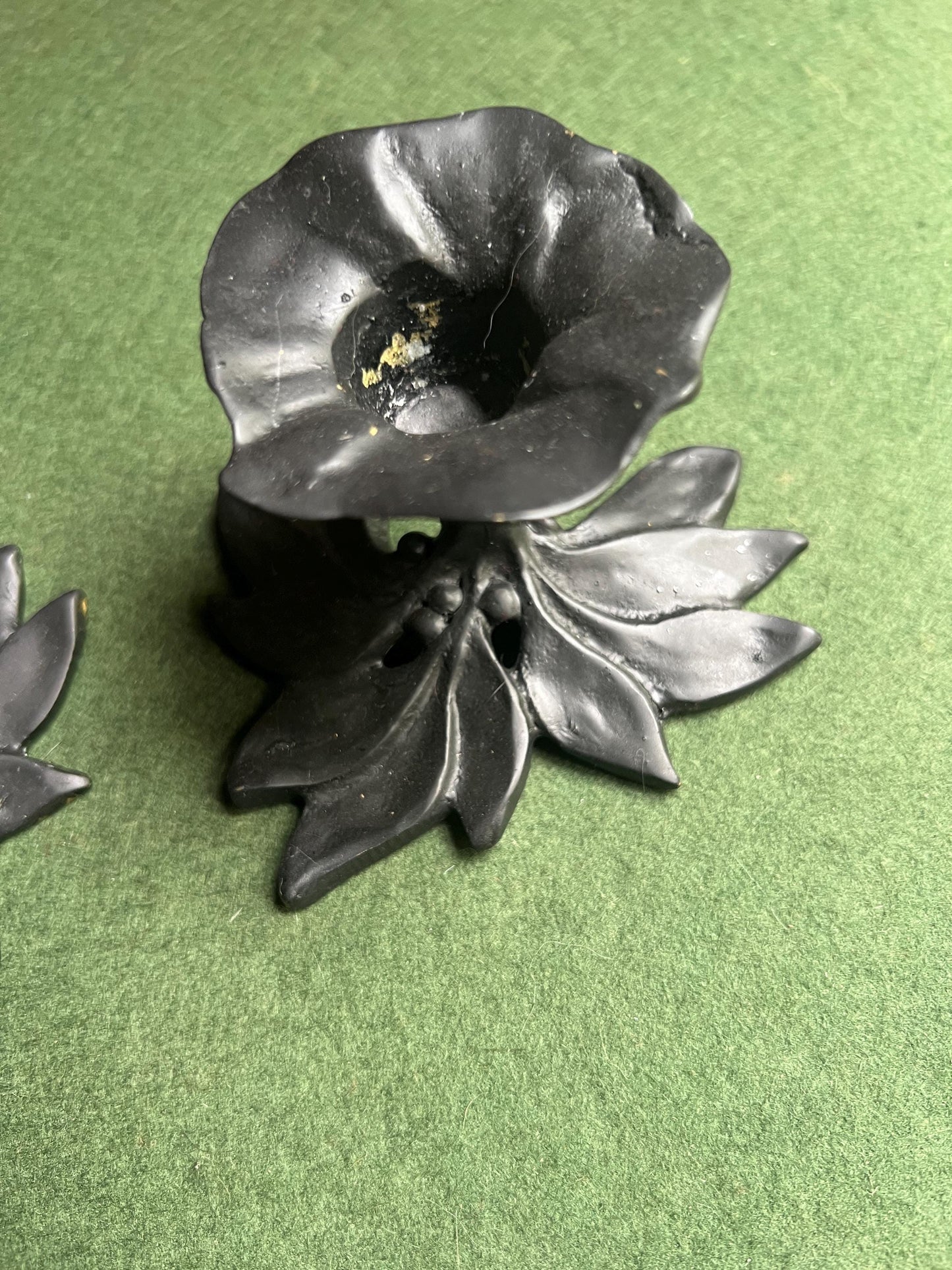 Pair of metal flower shaped candle holders Black metal trumpet flower with leaves