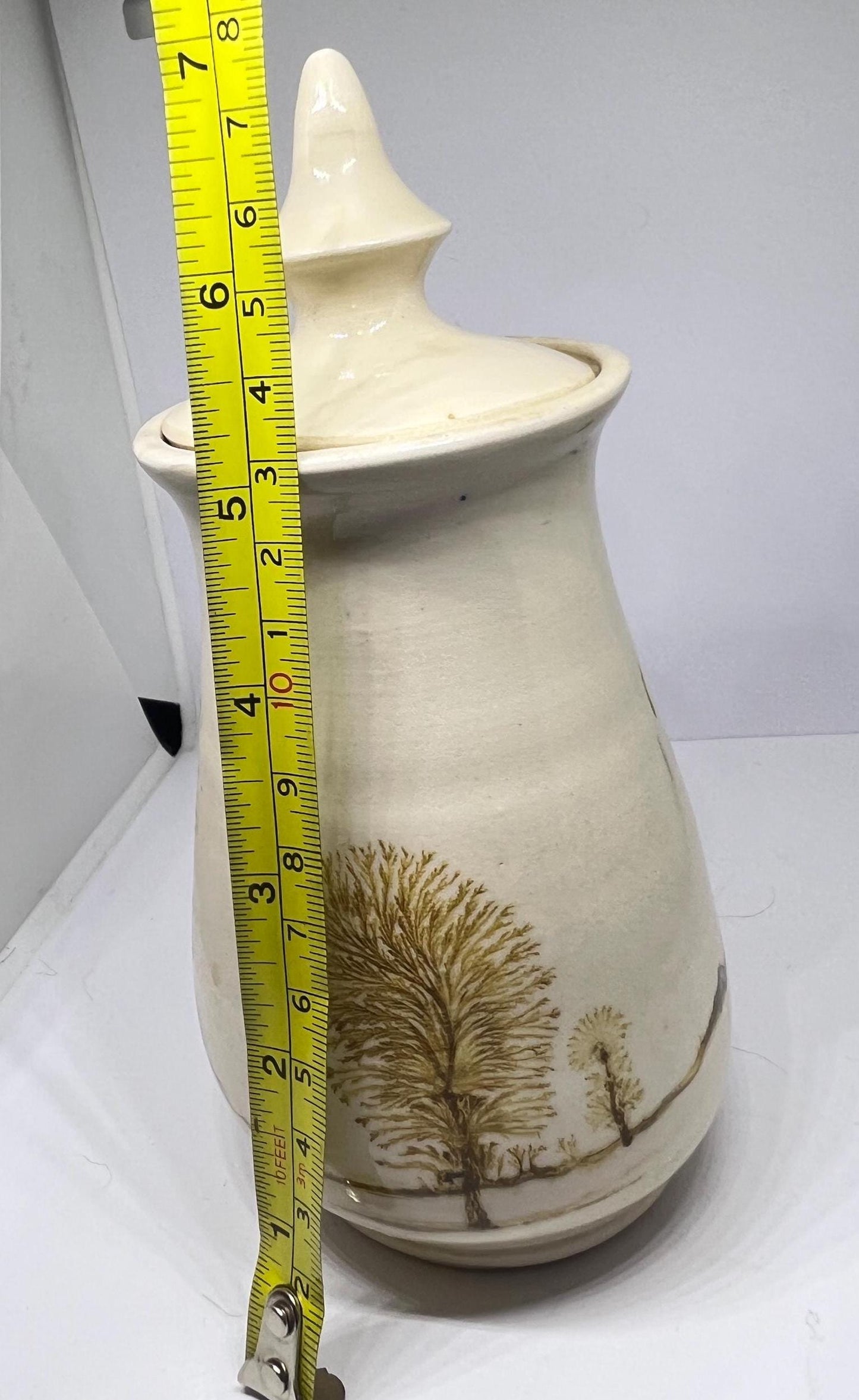 Studio pottery Mochaware lidded pot Cream glaze with tree design.
