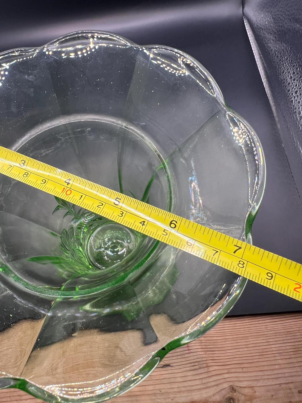 Vintage antique uranium glass vase. Octagonal base with flared ruffle rim and floral imprint.
