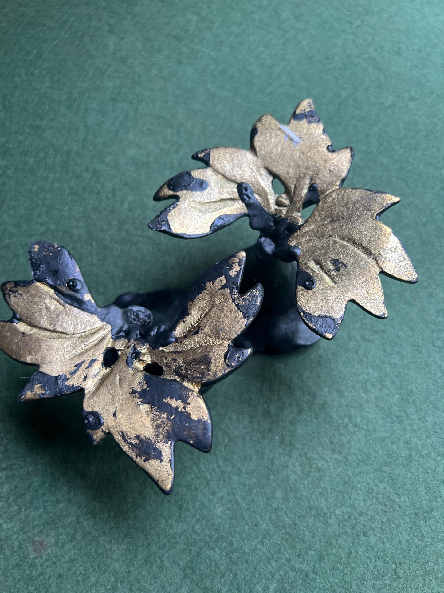 Pair of metal flower shaped candle holders Black metal trumpet flower with leaves