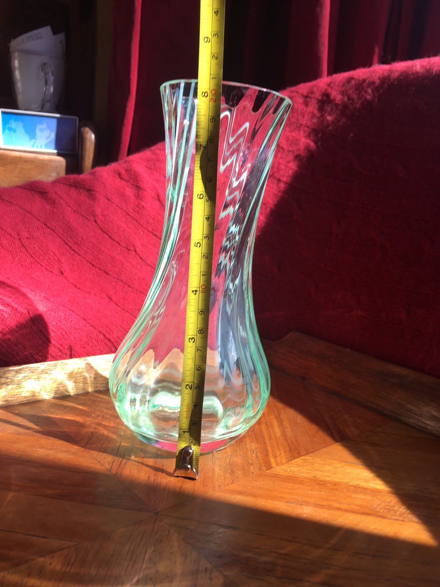 Beautiful vintage clear glass flower vase with green swirl detail. Heavy based.