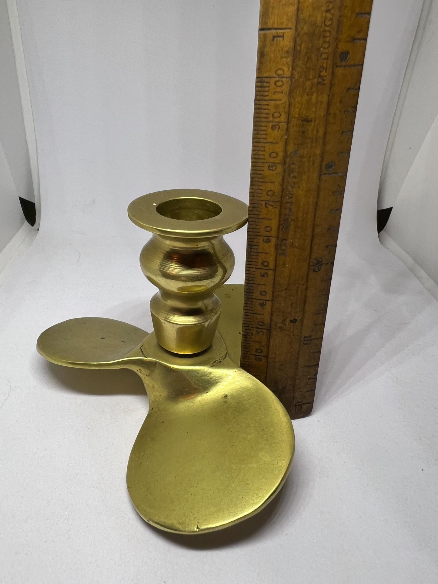 Brass candle stick Propellor shaped candle holder.