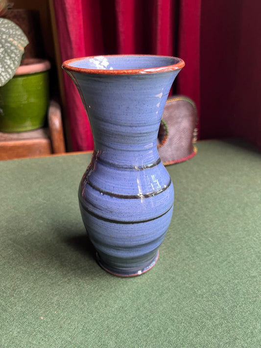 Beautiful vintage studio pottery vase. Blue glaze with black swirl and red rim. Stamped WOLD