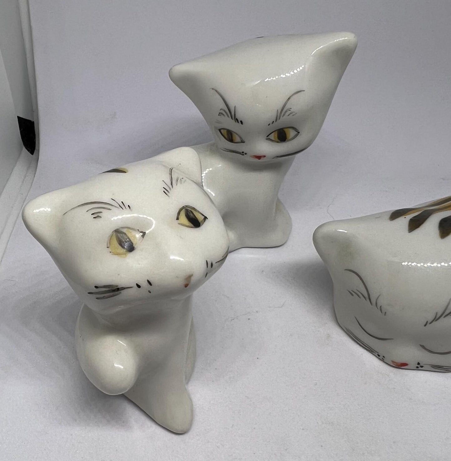 Cat family figurines. Ceramic cat ornaments
