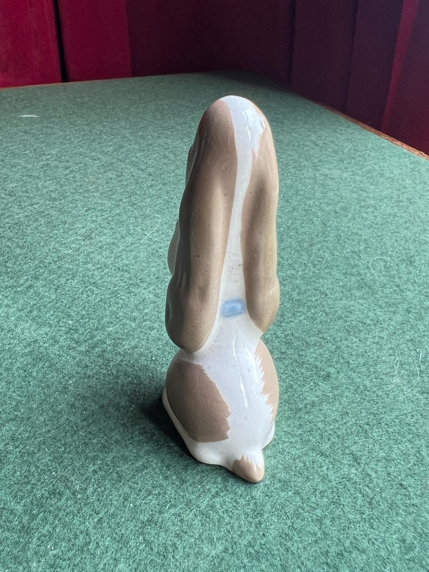 Ceramic sad hound dog figurine. Stamped Szeiler.