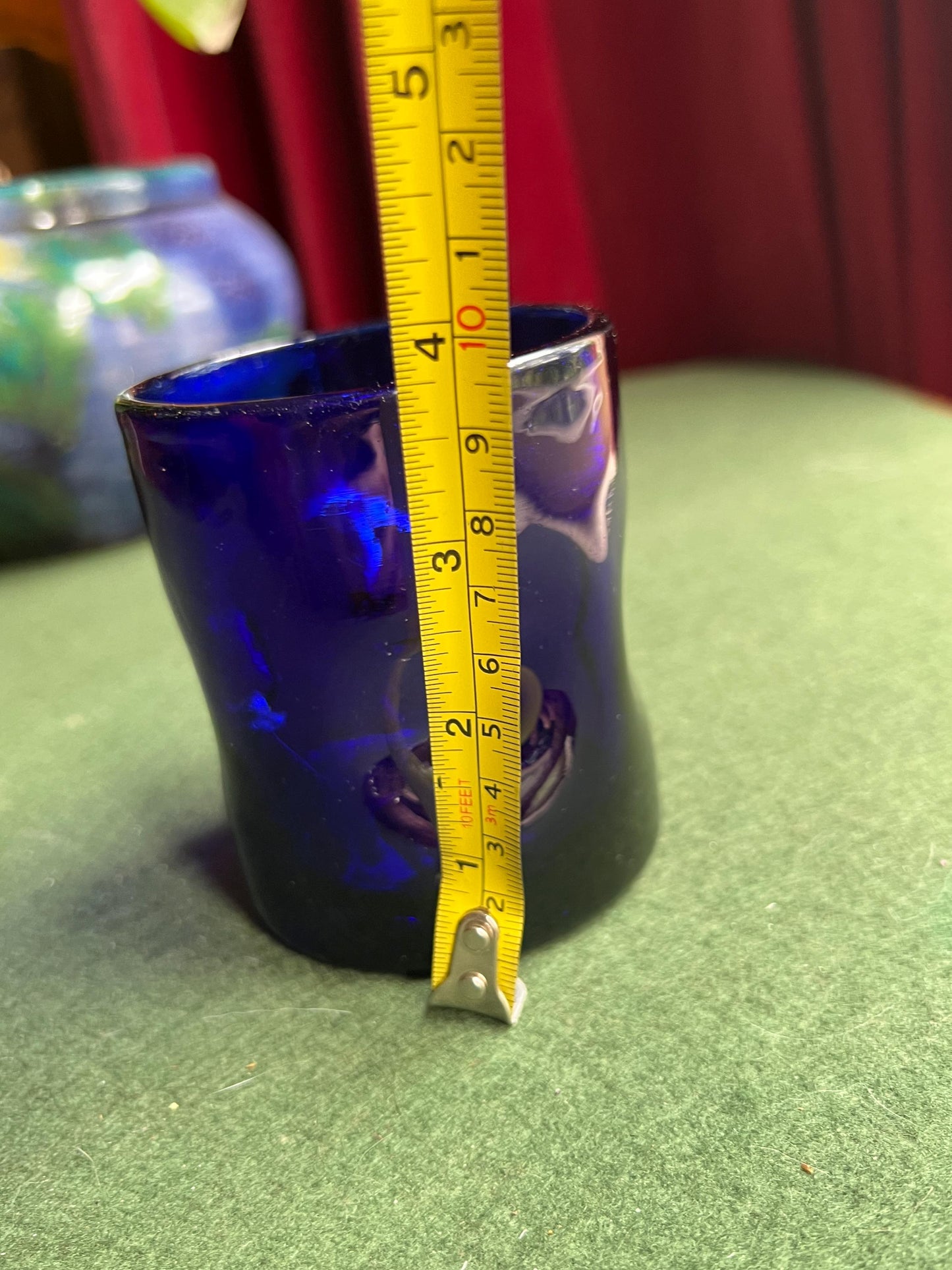 Pinched hand blown glass cobalt blue drinking glass posy vase.