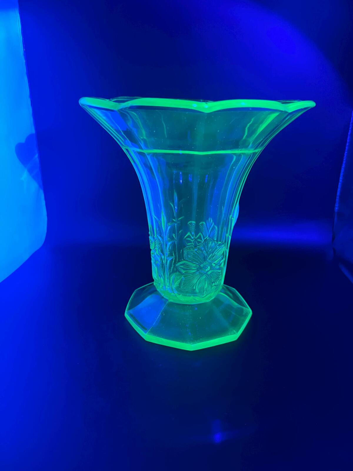 Vintage antique uranium glass vase. Octagonal base with flared ruffle rim and floral imprint.