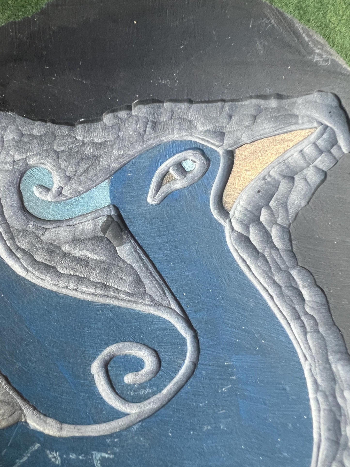 Stylised bird slate carving wall decor.