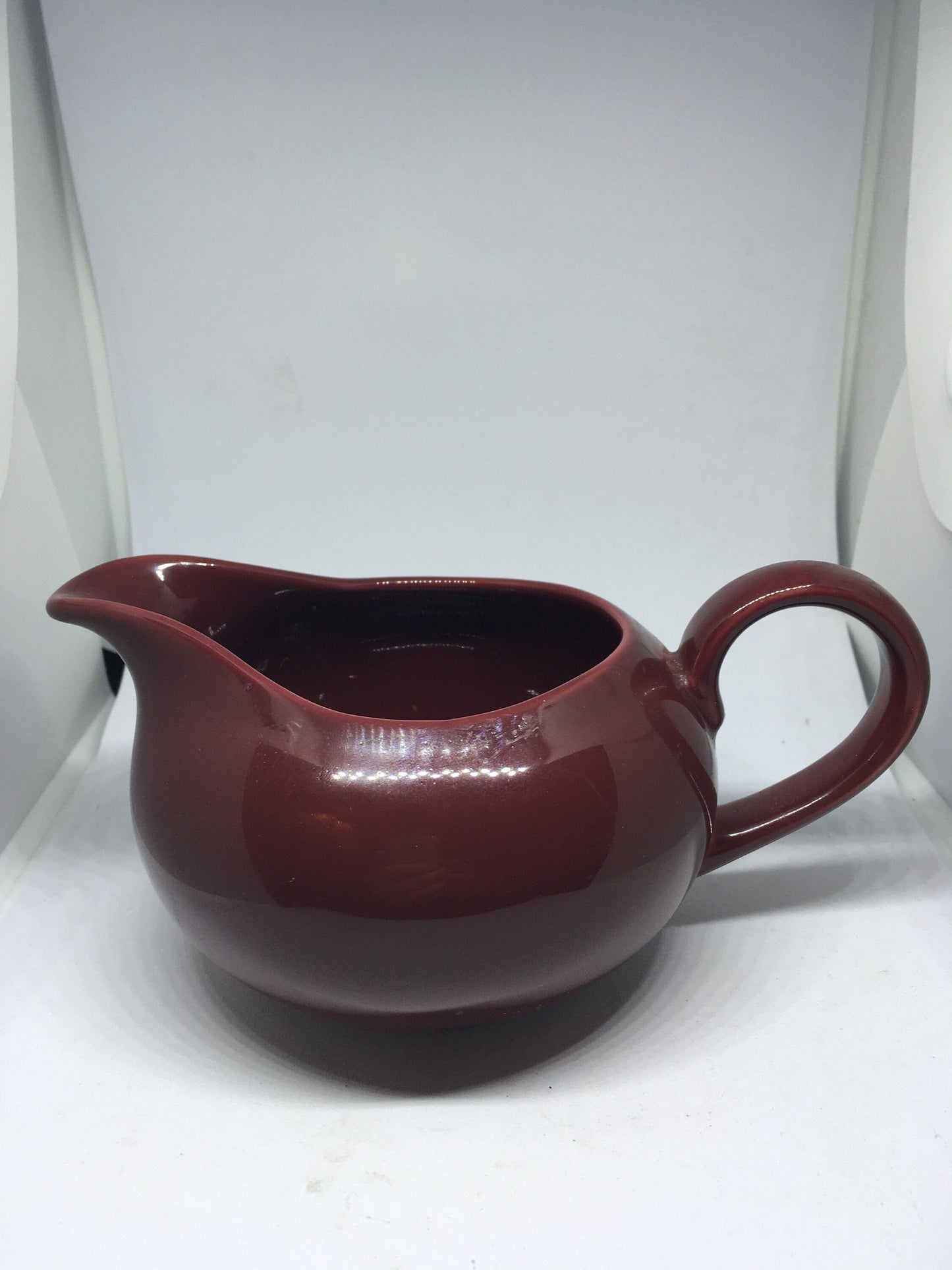 Rare vintage deep red Poole Pottery milk jug creamer sauce boat.
