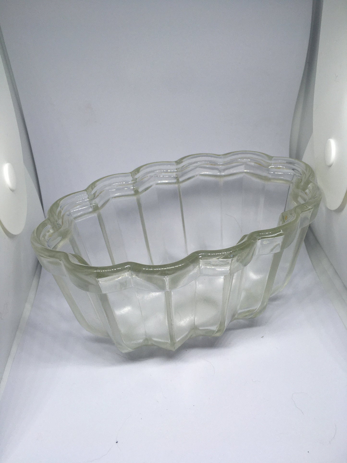 Vintage glass jelly mould. Clear pressed glass with scalloped edge. 10cm deep 16cm long.