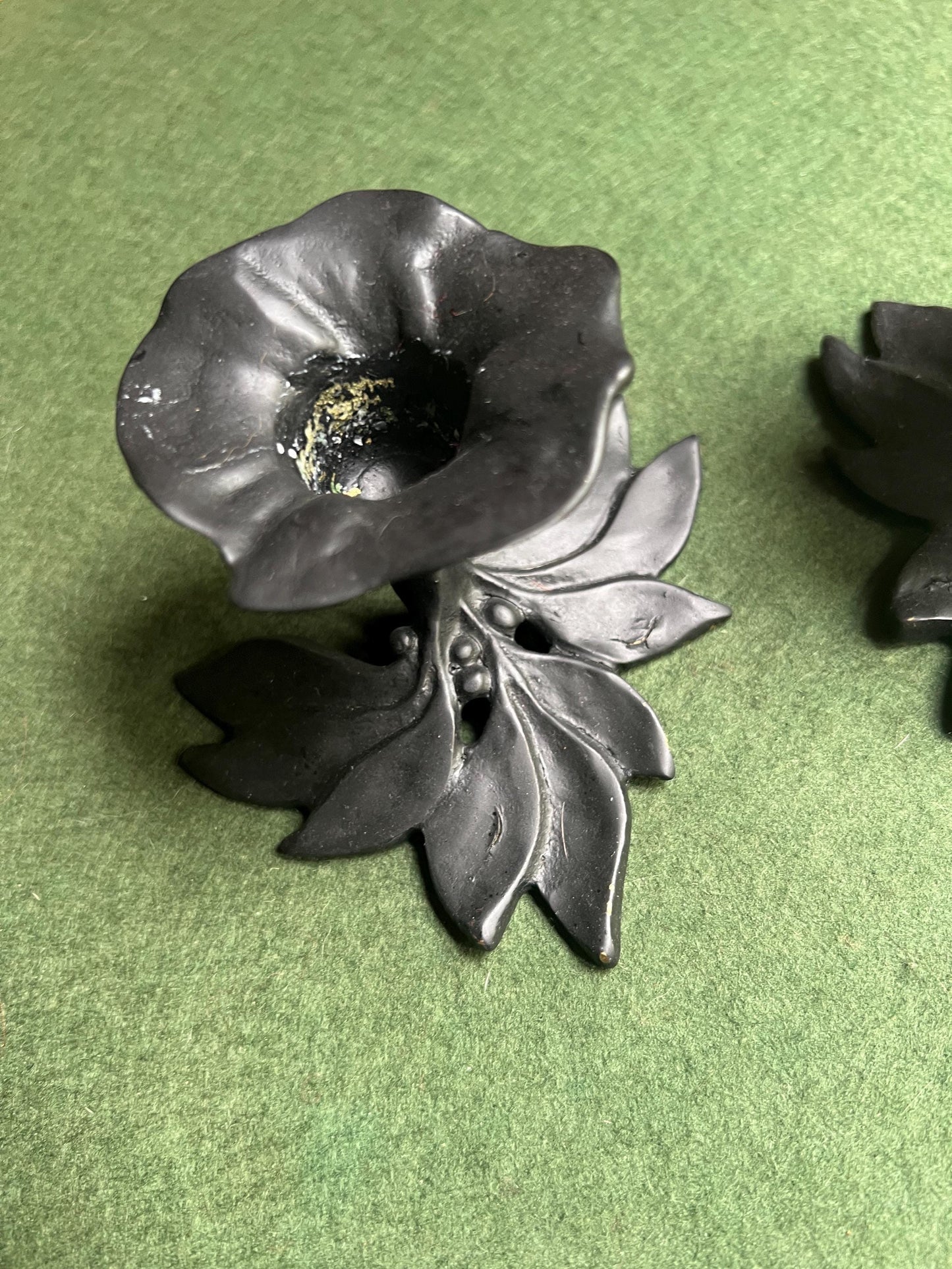 Pair of metal flower shaped candle holders Black metal trumpet flower with leaves