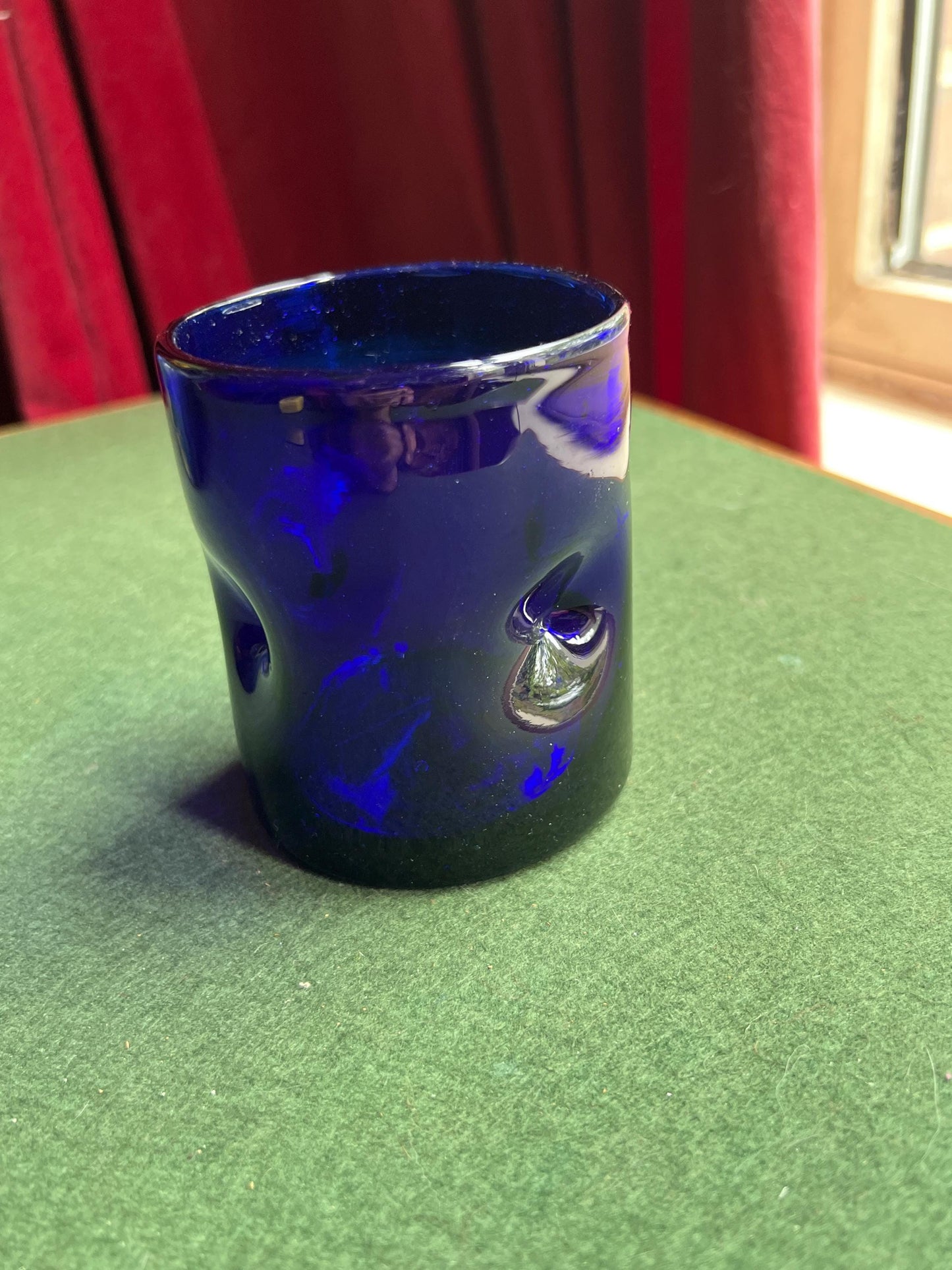 Pinched hand blown glass cobalt blue drinking glass posy vase.