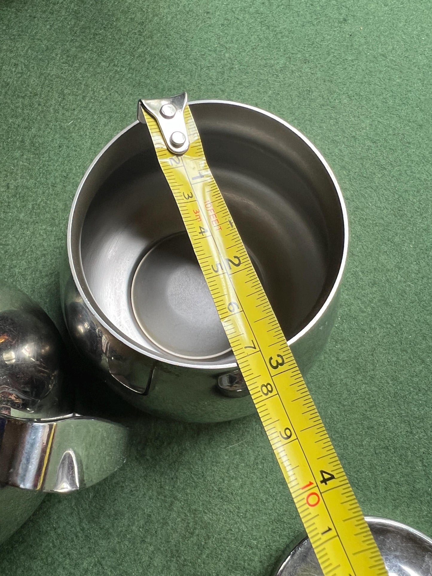 Stainless Steele lidded sugar bowl and creamer. Stamped Bramah of Sheffield Made in England.