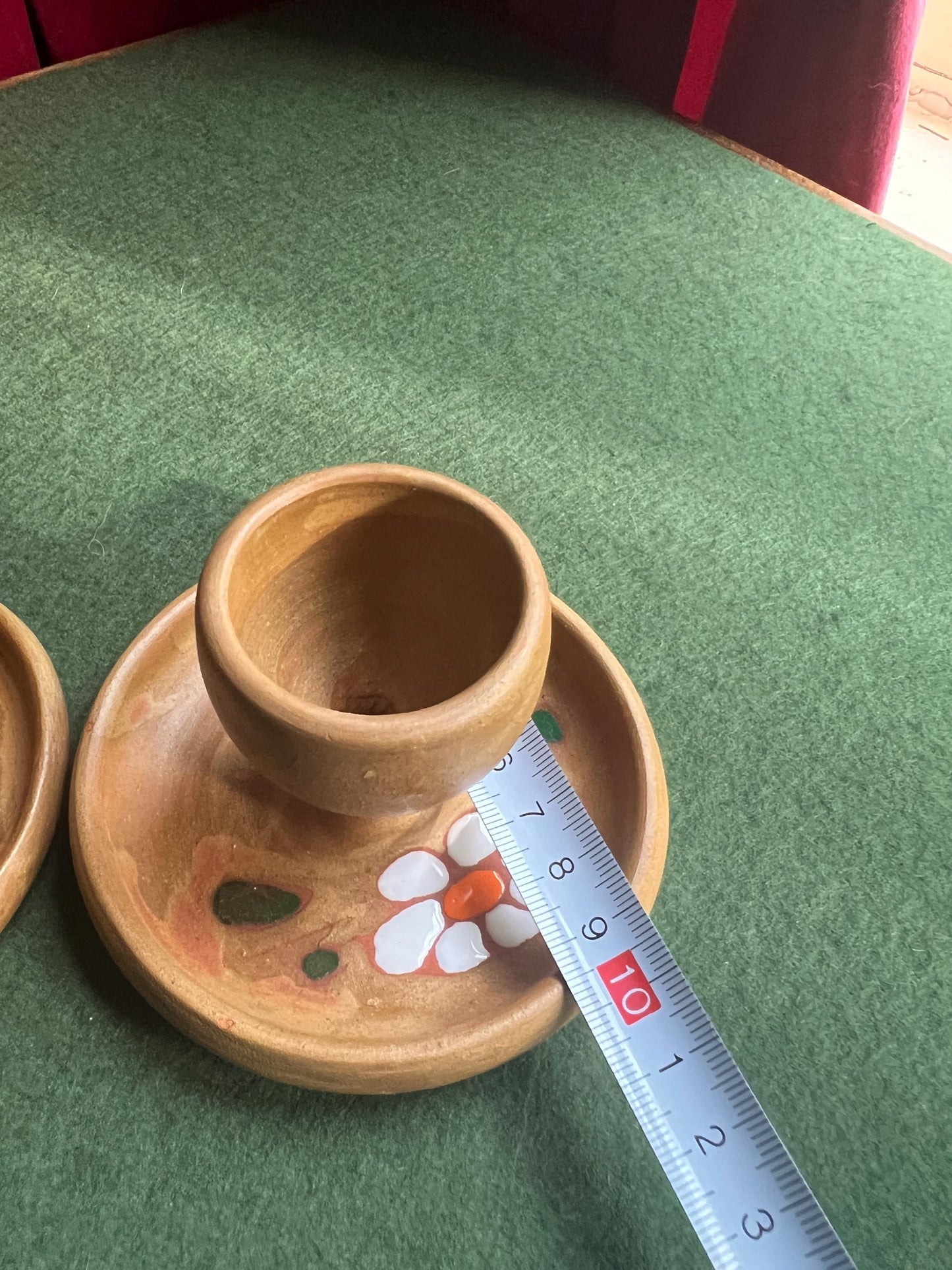 Pair of ceramic egg cups. Studio pottery brown glazed egg cups with integral saucers,