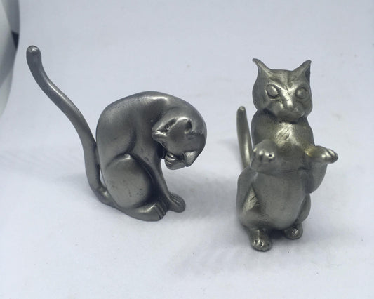 Two pewter cats.