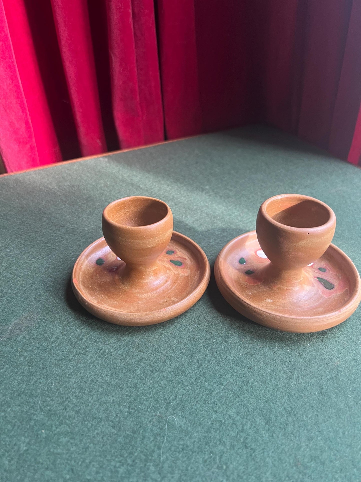 Pair of ceramic egg cups. Studio pottery brown glazed egg cups with integral saucers,