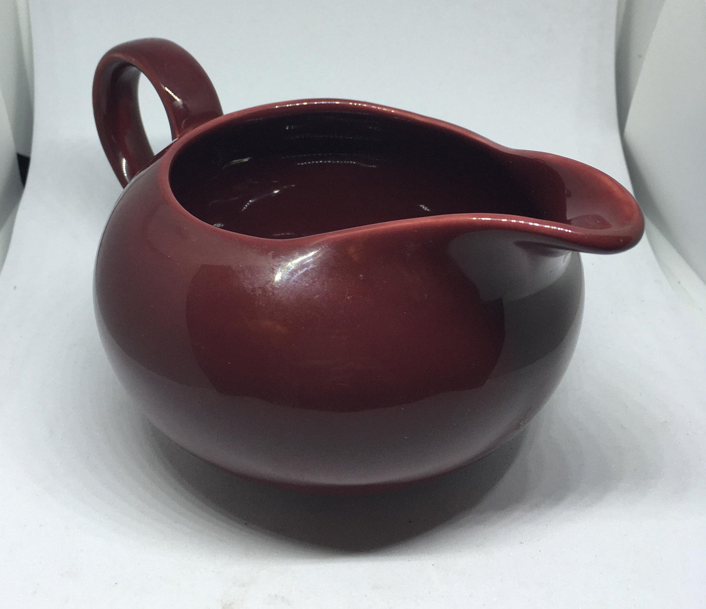 Rare vintage deep red Poole Pottery milk jug creamer sauce boat.