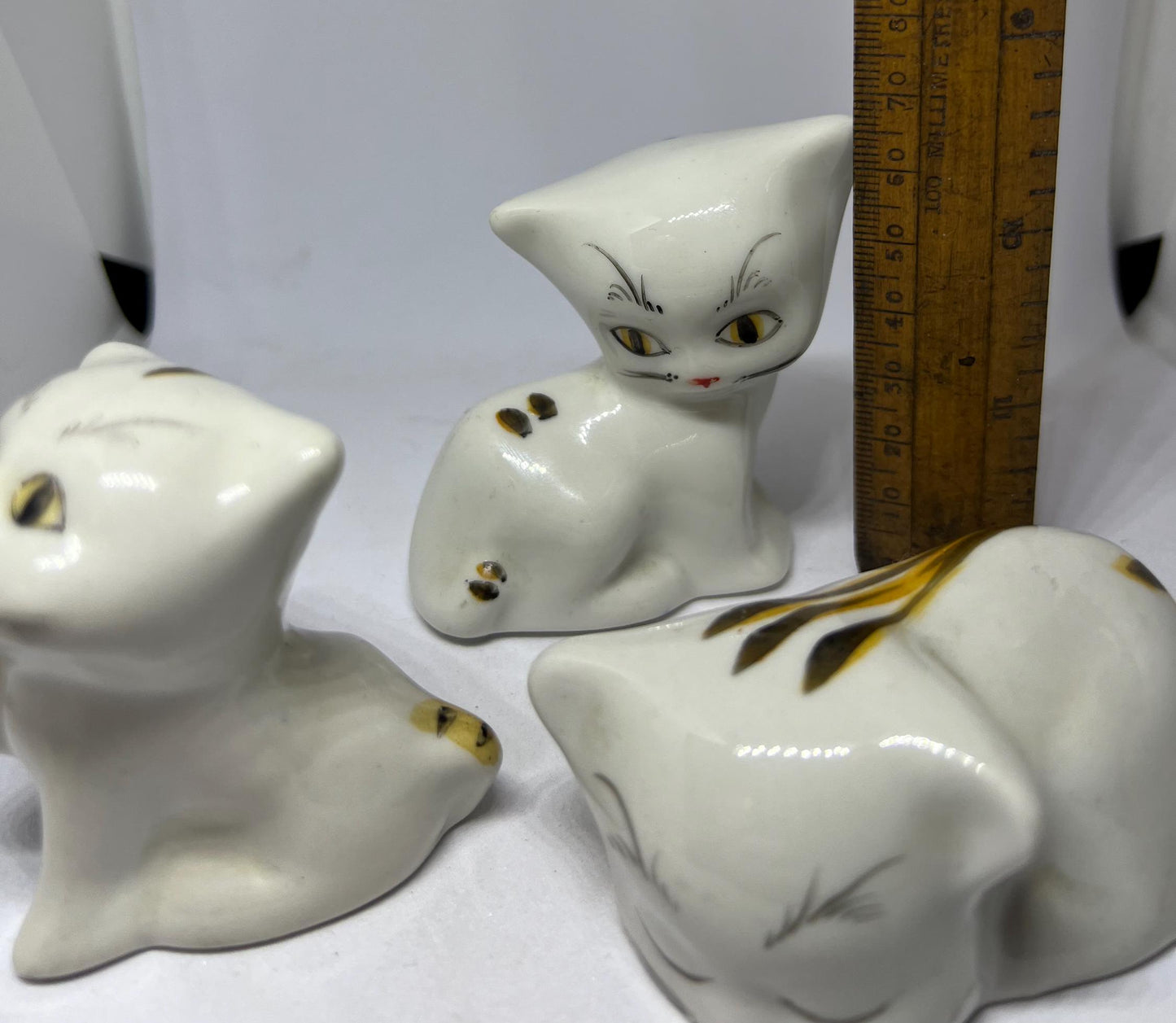 Cat family figurines. Ceramic cat ornaments