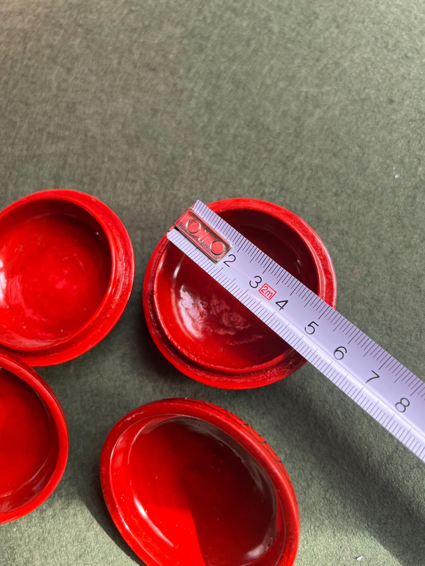 Pair of red and black lacquered lidded boxes. Tiny trinket ring boxes. Sold as a pair.
