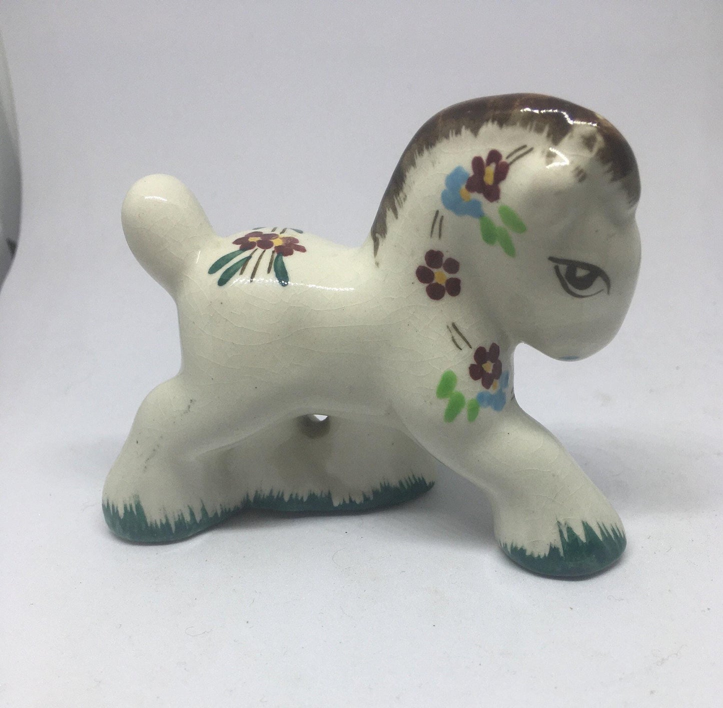 Folk art ceramic pony. Hand-painted prancing ceramic pony.