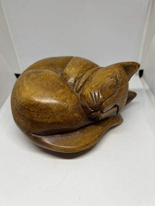 Vintage wooden curled sleeping kitten figurine.