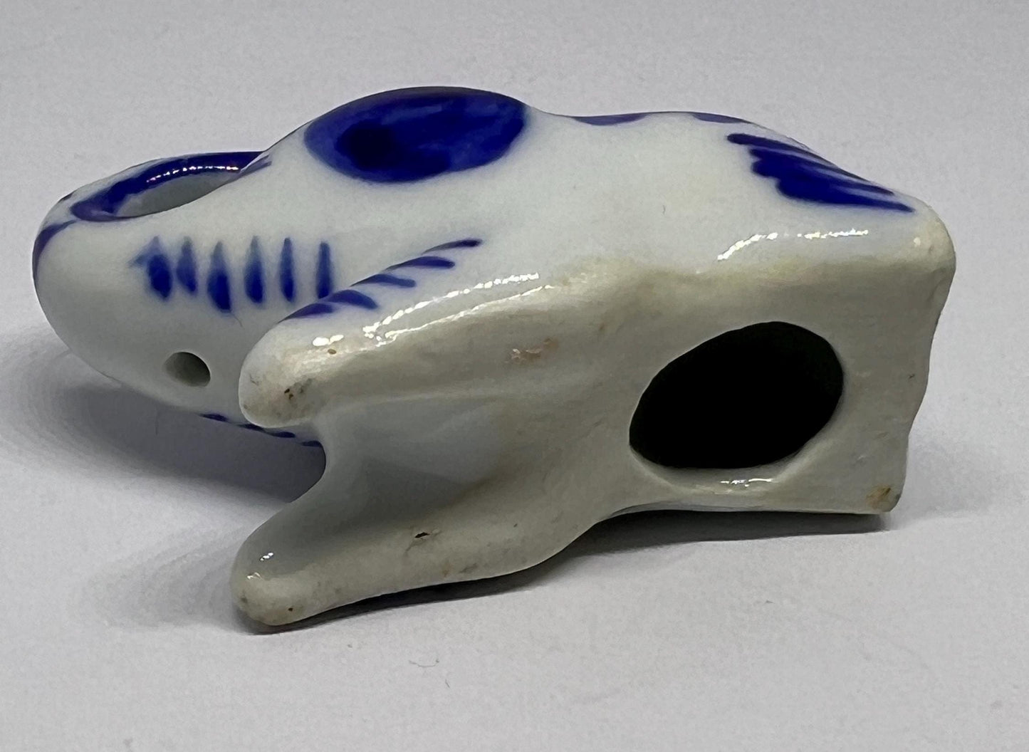 Blue white ceramic elephant figurine. Lucky trunk up sitting elephant ornament.
