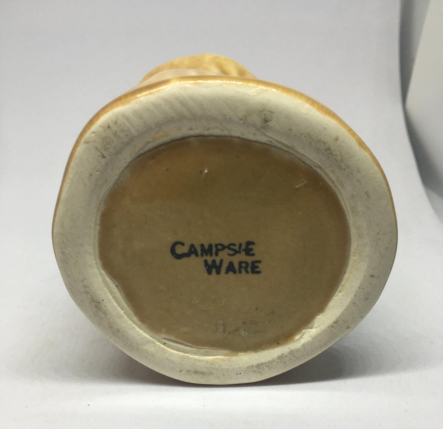 Campsie Ware green bunny by a tree stump planter vase.